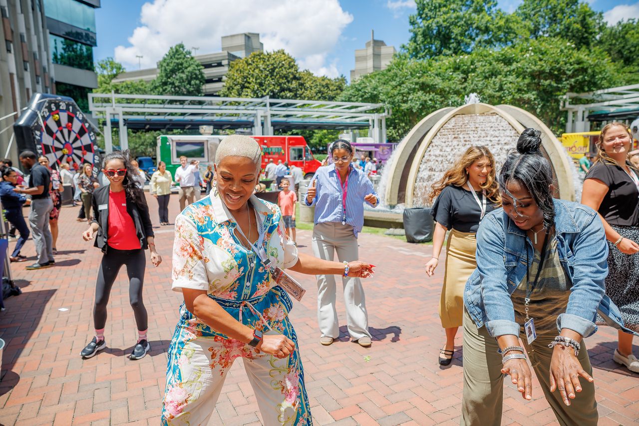 Guests dancing on the plaza during the tenant appreciation event