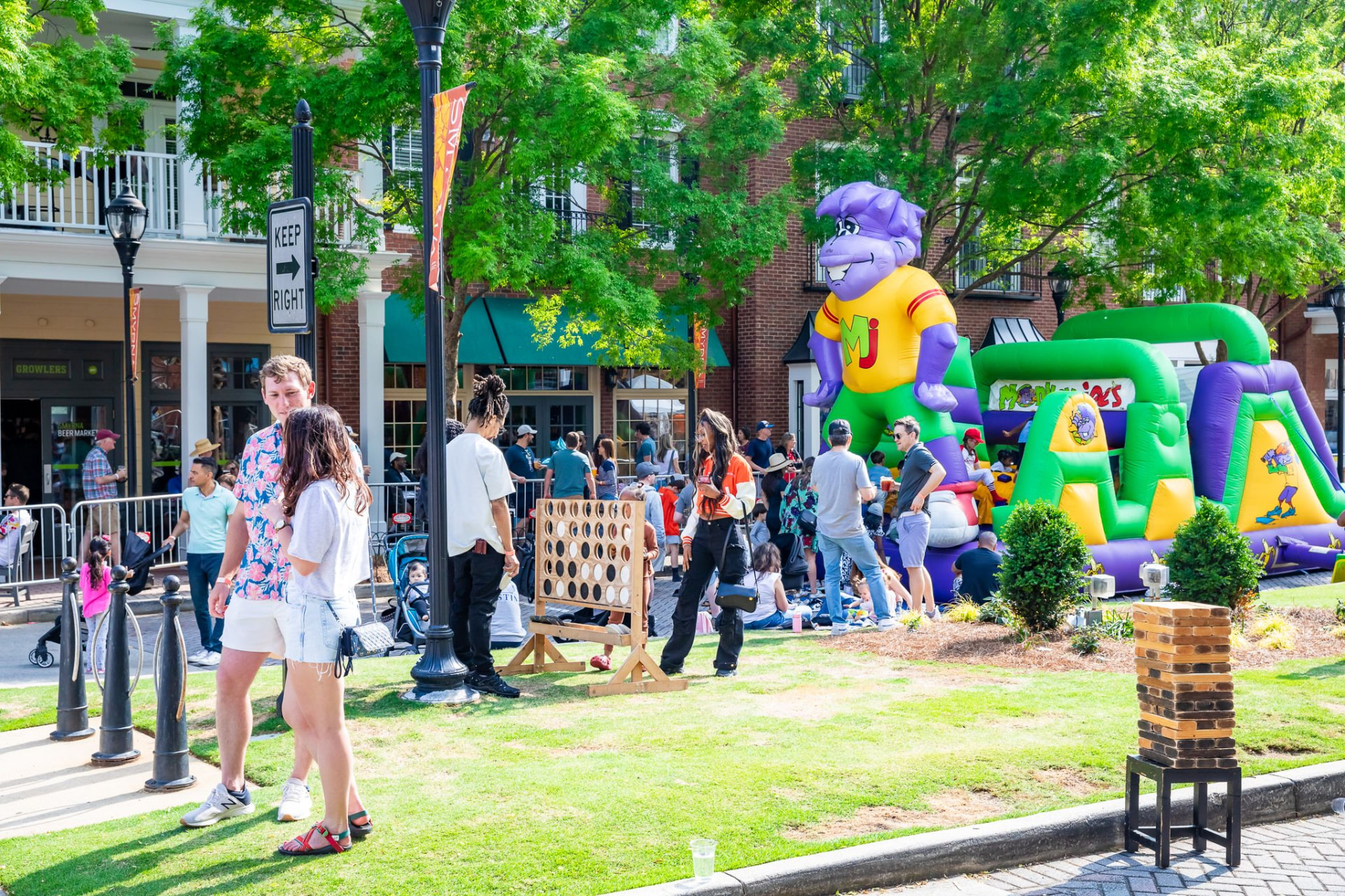 Lawn games and inflatables in the family zone at the Crawfish Boil festival